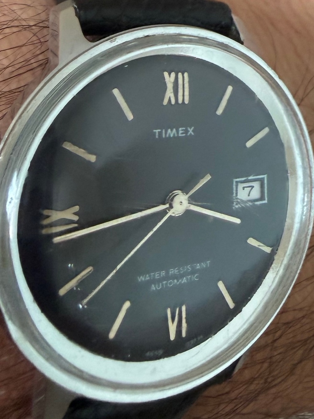 Vintage Timex 1974 Black Dial Watch with Gold Accents and Date Window